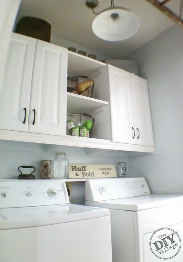 DIY Laundry Room makeover. I love these cabinets and the shelf between them. Gives functional and attractive.