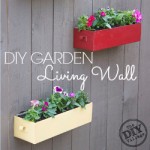 DIY Living Wall for your garden can be enjoyable year round depending on the types of plants that you use in the containers.