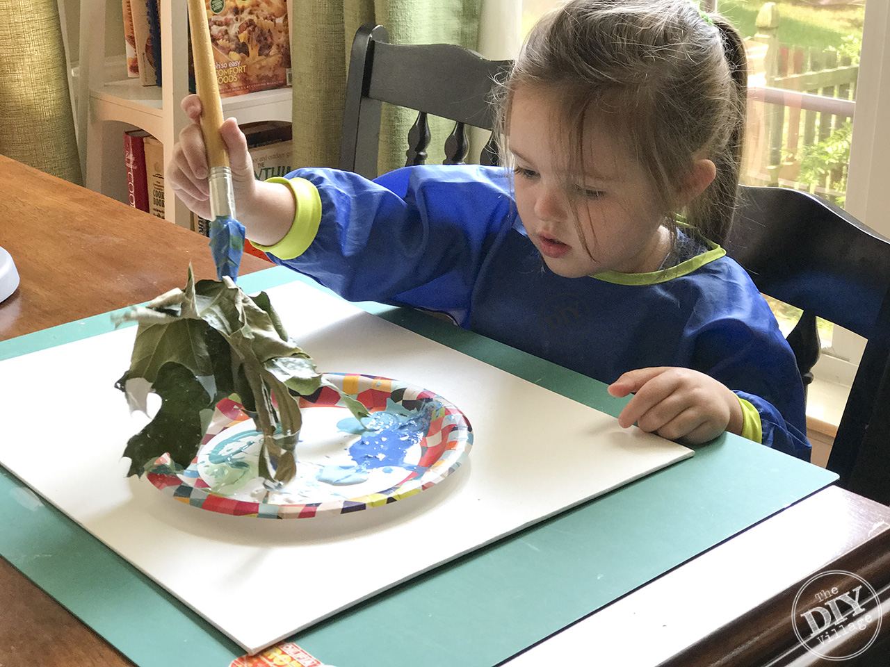 Creating art with kids doesn't have to be boring. Explore textures and different media by using found objects to paint. Leaf paint brush art is a great way to experiment.