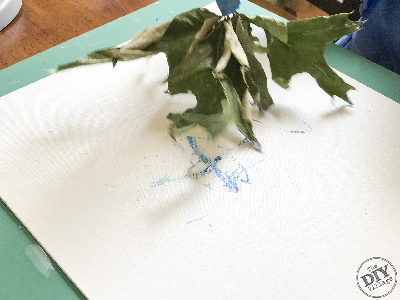 Creating art with kids doesn't have to be boring. Explore textures and different media by using found objects to paint. Leaf paint brush art is a great way to experiment.