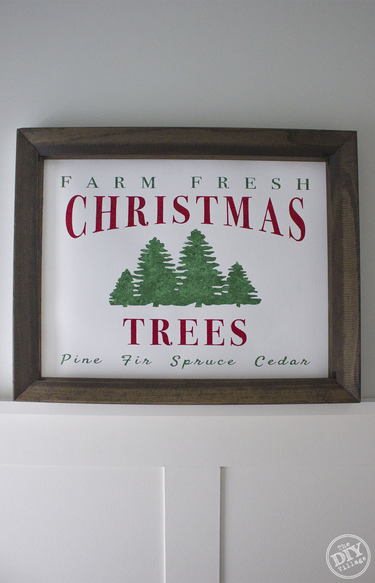 Creating your own framed canvas art has never been easier. Step by step process of how to create a custom DIY Farm Fresh Christmas Tree Sign