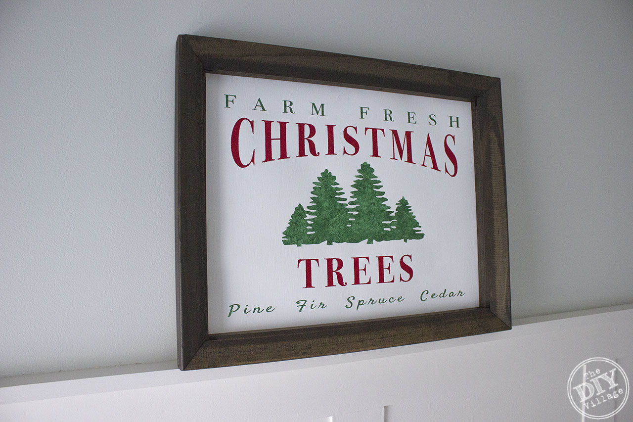 Creating your own framed canvas art has never been easier. Step by step process of how to create a custom DIY Farm Fresh Christmas Tree Sign