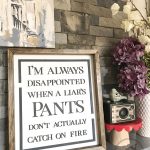 DIY laser cut "Pants on Fire" sign. Funny raised wood lettered sign for home. #lasercutter #diy #crafts #homedecor #funnysign #snarkysign #glowforge