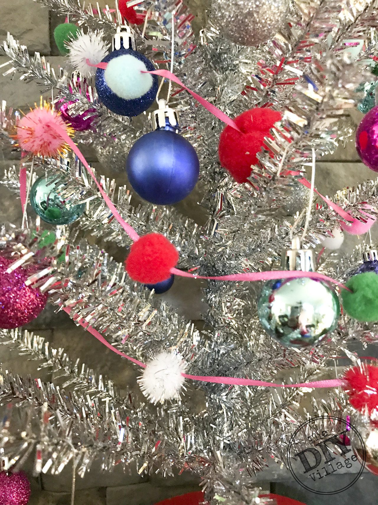 Easy DIY pom pom garland with dollar store items. #pompom #garland #diy #christmas