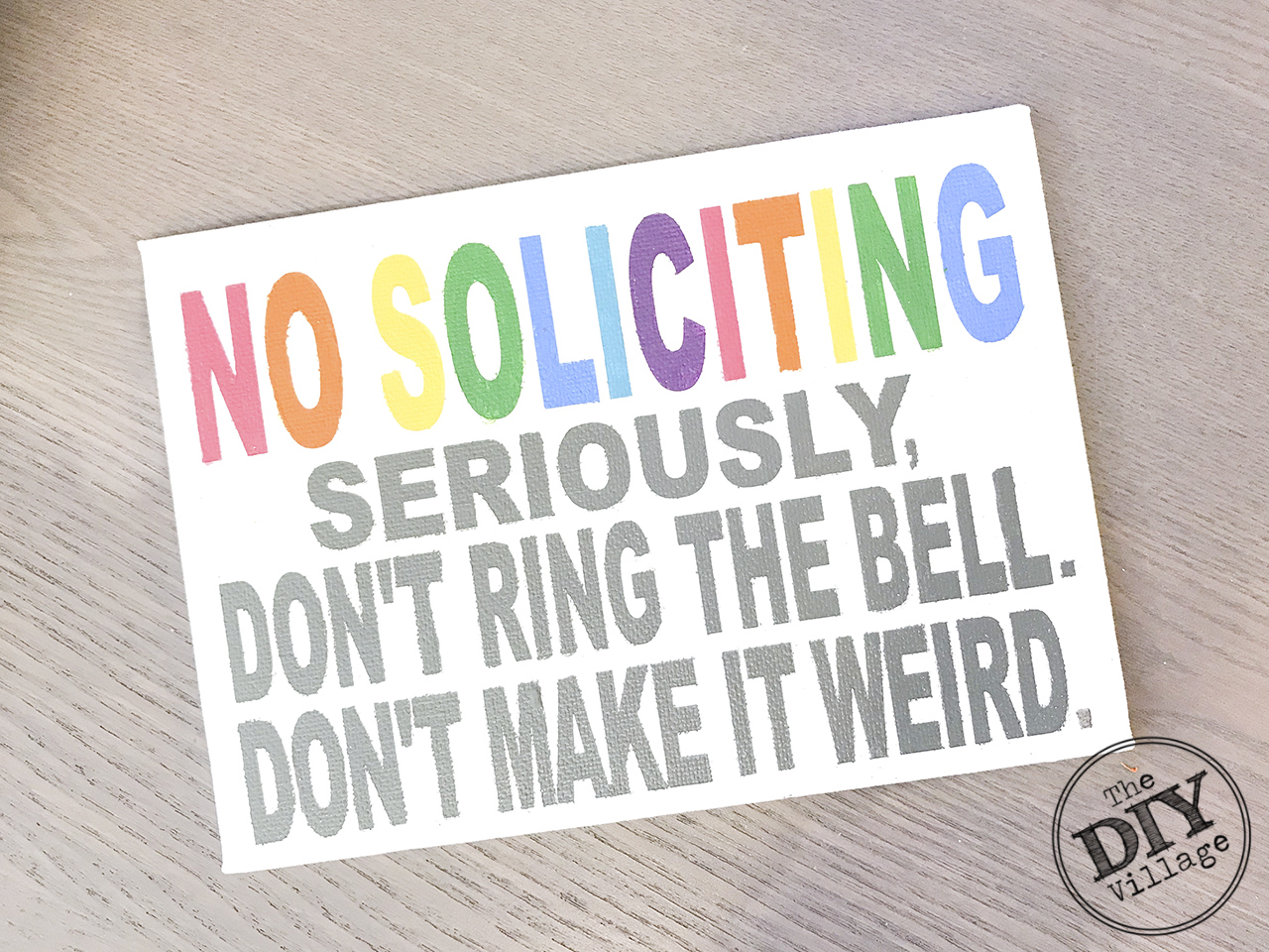 Rainbow colored words snarky No soliciting sign