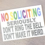 Rainbow colored words snarky No soliciting sign